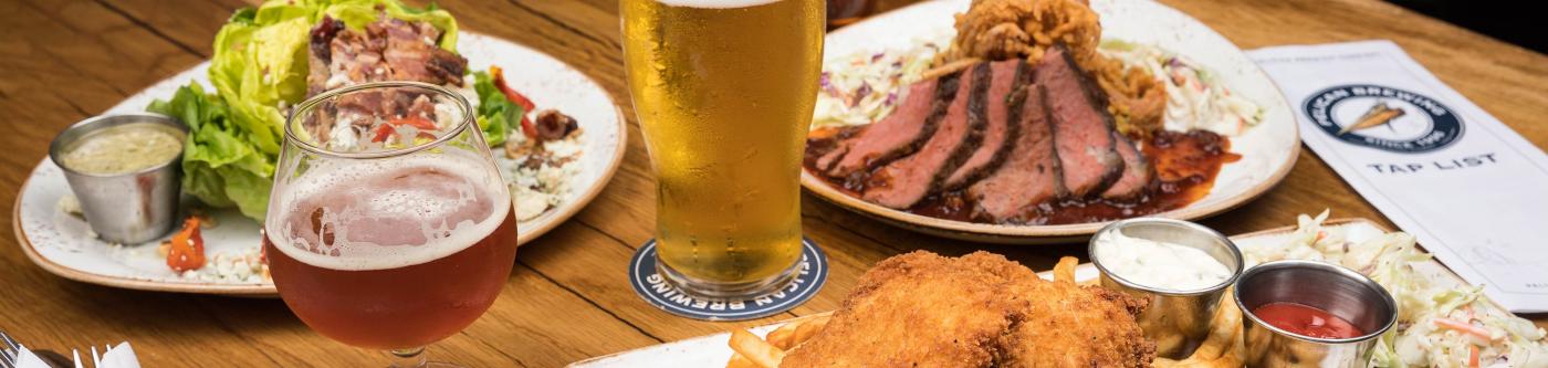 A table full of food at pelican brewing company in Cannon Beach OR